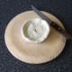 Lid is carefully placed on Scotch pie and a steam vent is cut