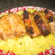 Arrange pork on platter and drizzle with more sauce.