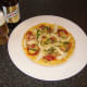 Chicken and chorizo pizza omelette is served with a Spanish beer