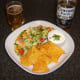 Corona beer is served with spicy chicken pizza omelette