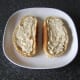 Horseradish sauce is spread evenly over bread
