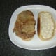 Steak is laid on one slice of bread