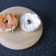 Smoked salmon is laid on one half of the bagel