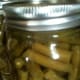 The processed green beans will continue to bubble inside. This is completely normal for pressure canning.