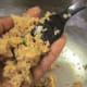 Scooping up mixture to form salmon patty is easy.