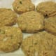 Salmon patties are placed on waxed paper ready to fry.