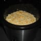 Pour the macaroni and cheese mixture into a medium-sized crock pot.