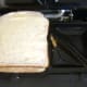 Assembled haggis and cheese sandwich ready for toasting