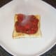 Spicy tomato sauce is spooned on to toast