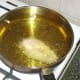 Deep frying battered chicken breast.
