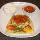 Mango chutney is spooned on to curried chicken burger.