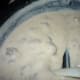 As the gravy starts to thicken, you'll start to be able to see the bottom of the pan as you stir.