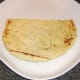 Half naan bread is plated