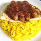 Bhuna sauce is spooned on top of sausages