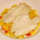 Plaice fillets are lifted on to spicy rice bed
