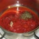 Preparing a simple tomato sauce for plaice and pasta bake