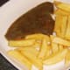 Chips are plated with plaice fillet