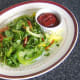 Salad bed and spicy dip for plaice