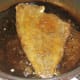 Plaice fillet completes cooking on flesh side