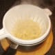 Cooked tagliatelle pasta is drained