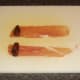 A date is laid at one end of each strip of Parm ham
