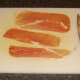 Slicing strips of Parma ham