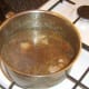 Beef stock is added to browned venison