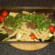Venison, pasta and parsley added to roasted vegetables