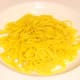 Turmeric spiced spaghetti is plated