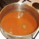 Stock is added to pasta sauce