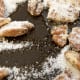 Step 2: Watch for sugar to start melting. If sugar doesn't melt in a couple of minutes, you can cover the pan for a minute or two.