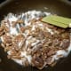 Step 1: Put pecans and sugar in skillet and stir.