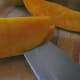 Removing the skin of a mango