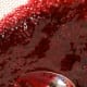 Using the back of a spoon, gently push the liquid through a fine sieve into a bowl. Discard the seeds and pulp.