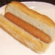 Hot dog is laid in sub roll