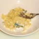 Banana is mashed with the back of a fork