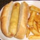 Chips are added to the plate with the sub roll and battered hot dog