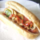 Stir fried peppers and mushrooms on hot dog