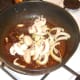 Mushroom and onion added to fried spices