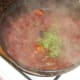 Chopped coriander is stirred through bhuna sauce