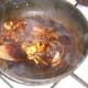Stirring mushroom and onion through fried spice mix