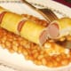 Tucking in to sausage roll dog
