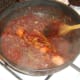 Dog is carefully covered with bhuna sauce to heat through