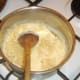 Macaroni added to cheese sauce