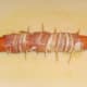 Bacon wrapped dog ready for deep frying