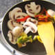 Stir frying mushrooms and peppers