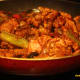 Add the seasonings and then the fried pork pieces. Toss well.
