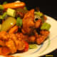Serve chili pork sprinkled with chopped spring onions on top.
