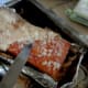 After cooking for 45-50 minutes, chisel away the layer of salt with a knife. (Excuse the blurry photo, the photographer was trembling with excitement at the sight of the rind!)