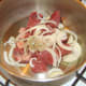 Browning shin of beef and onion.